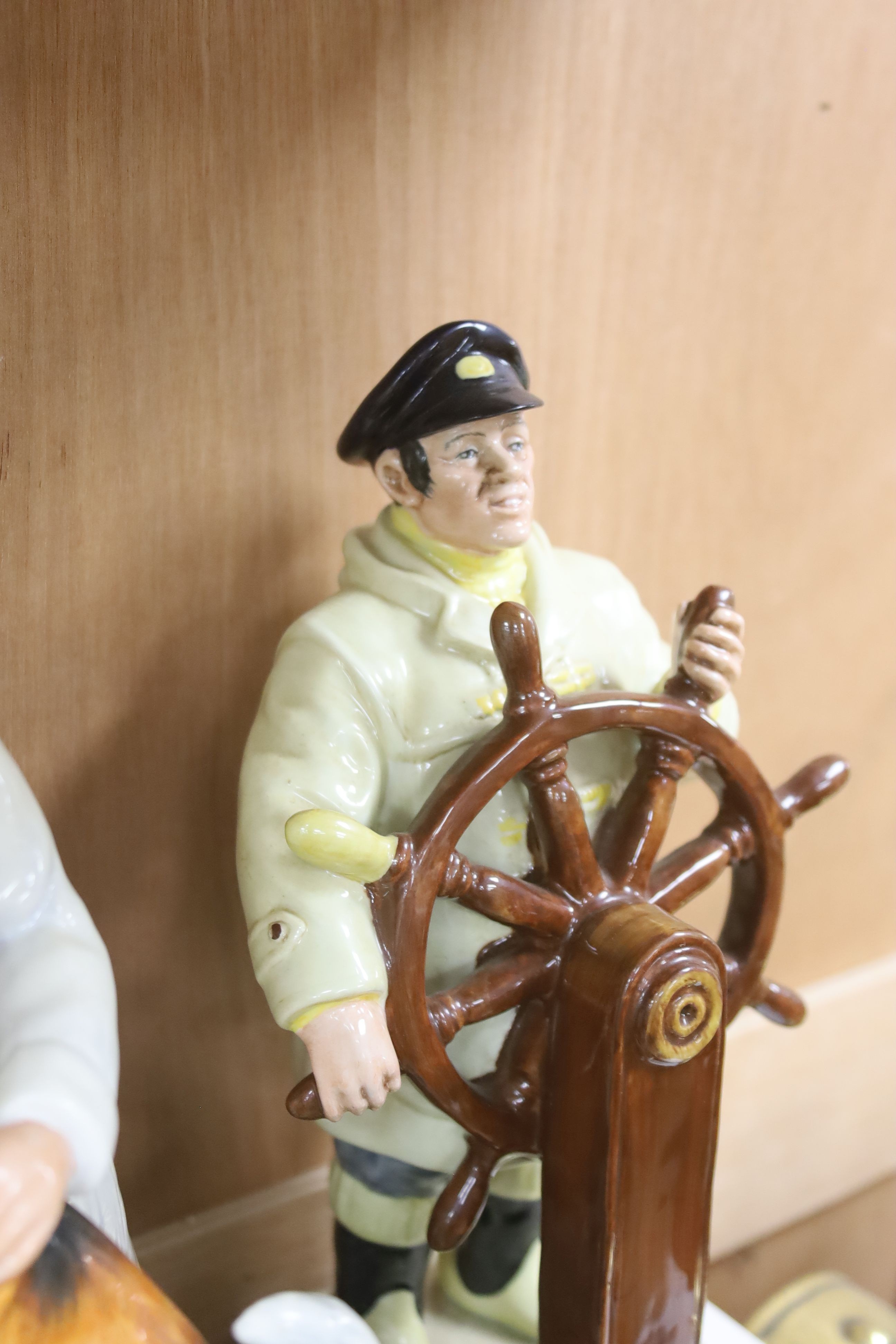 Eight Royal Doulton figures including: The Helmsman, The China Restorer, The Boatman, Sweet Dreams, Eventide, Captain Outtle and Mr Pickwick, tallest 24cm